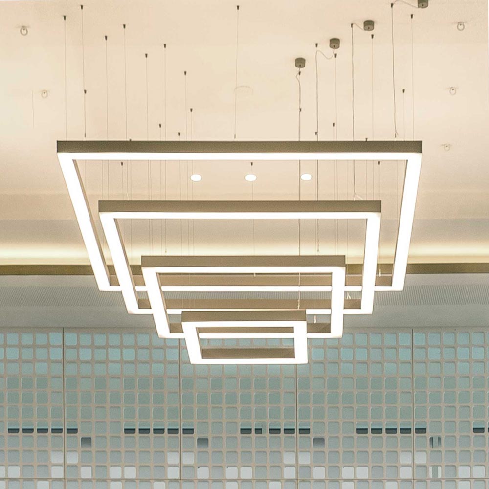 Customised LED lighting solution with customisable design. Composition of several profile systems, arranged as a sloping pyramid.